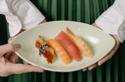 A server presenting a dish — the full offering available through the Hydra ordering interface.